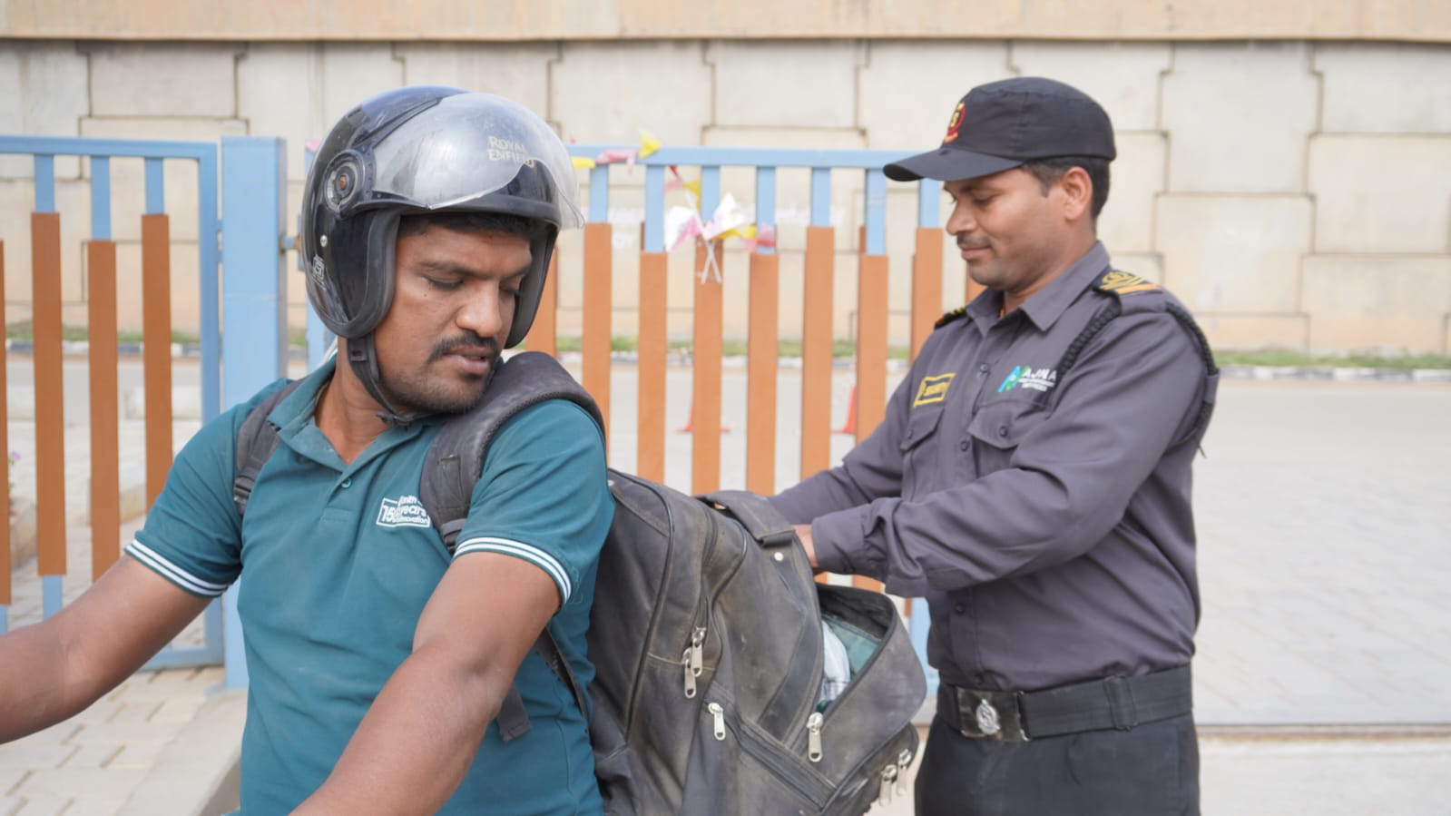 Bag screening &mdash; Routine bag checks carried out courteously at the gate.